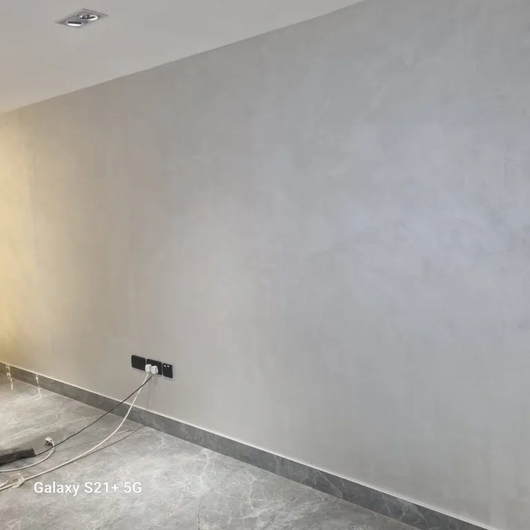 Grey decorative textured wall finish on the DIFC office wall