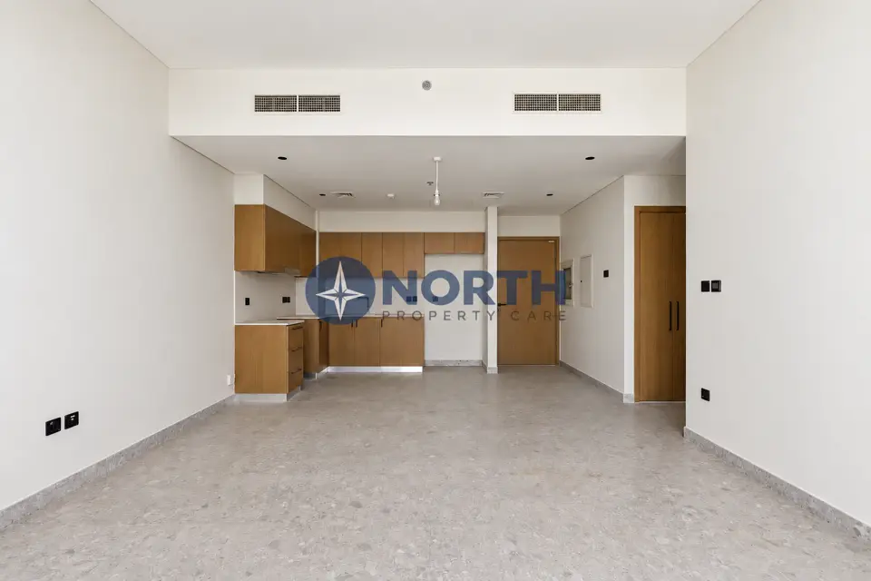 Golf Suites living area and kitchen walls after the same-colour repaint