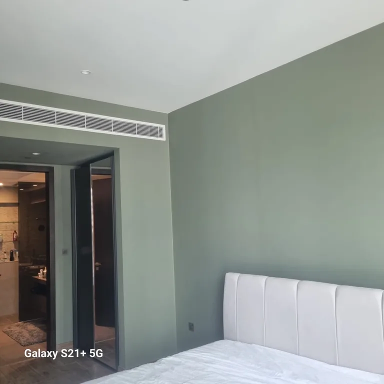 Bedroom walls painted green in a Jumeirah Beach Residence apartment by North Property Care