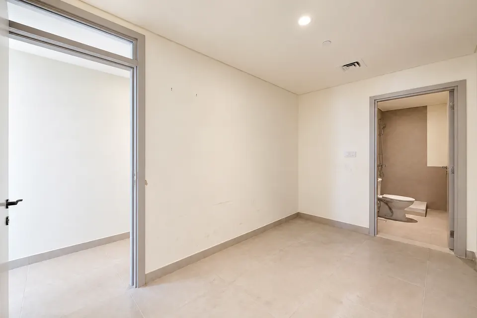 Bedroom and bathroom doorway at Beach Mansion before interior painting