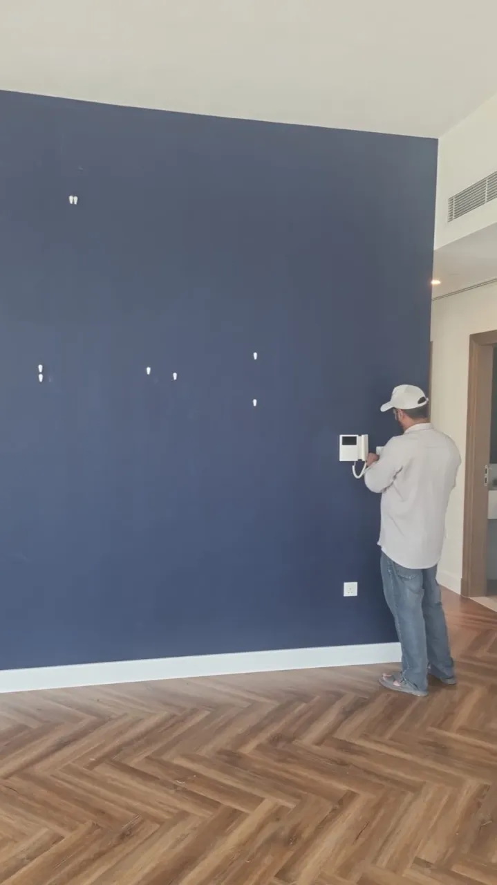 Wall after picture removal with picture-hanging holes filled, ready for repainting