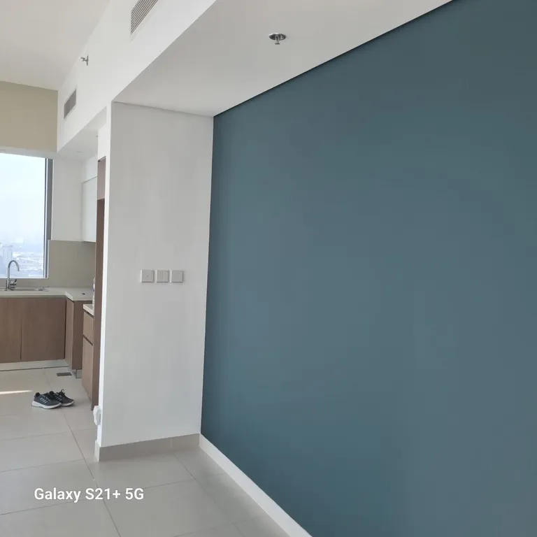 Finished blue feature wall in a Dubai Creek Harbour apartment painted by North Property Care