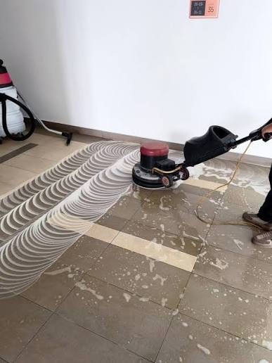 Machine-assisted floor deep cleaning during a residential service in Dubai