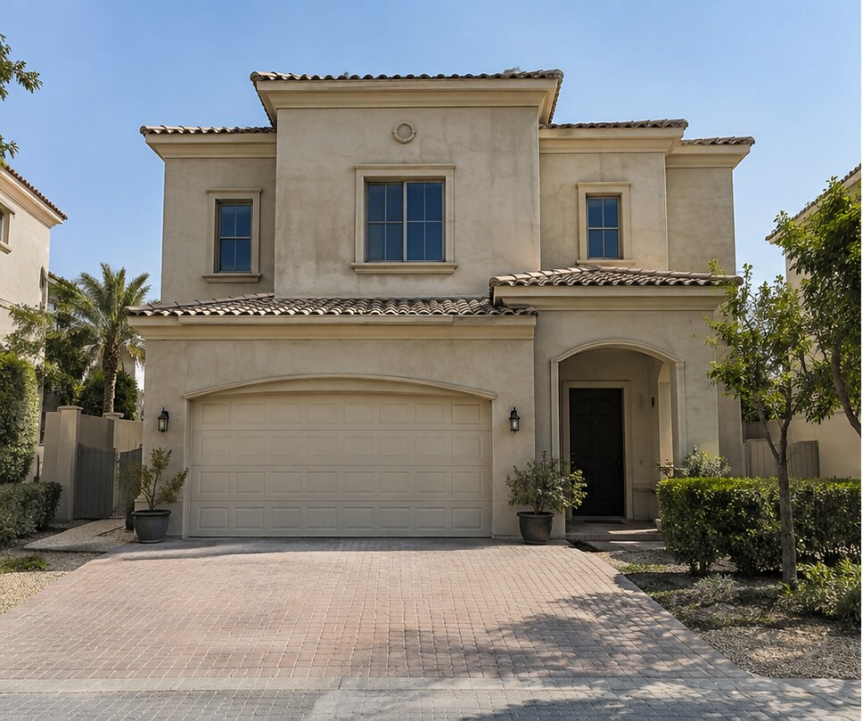 Villa exterior before repainting, with a weathered cream finish